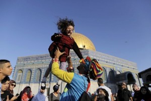  A Palestinian girl on the first day of the Muslim holiday of Eid al-Fitr. Source. 